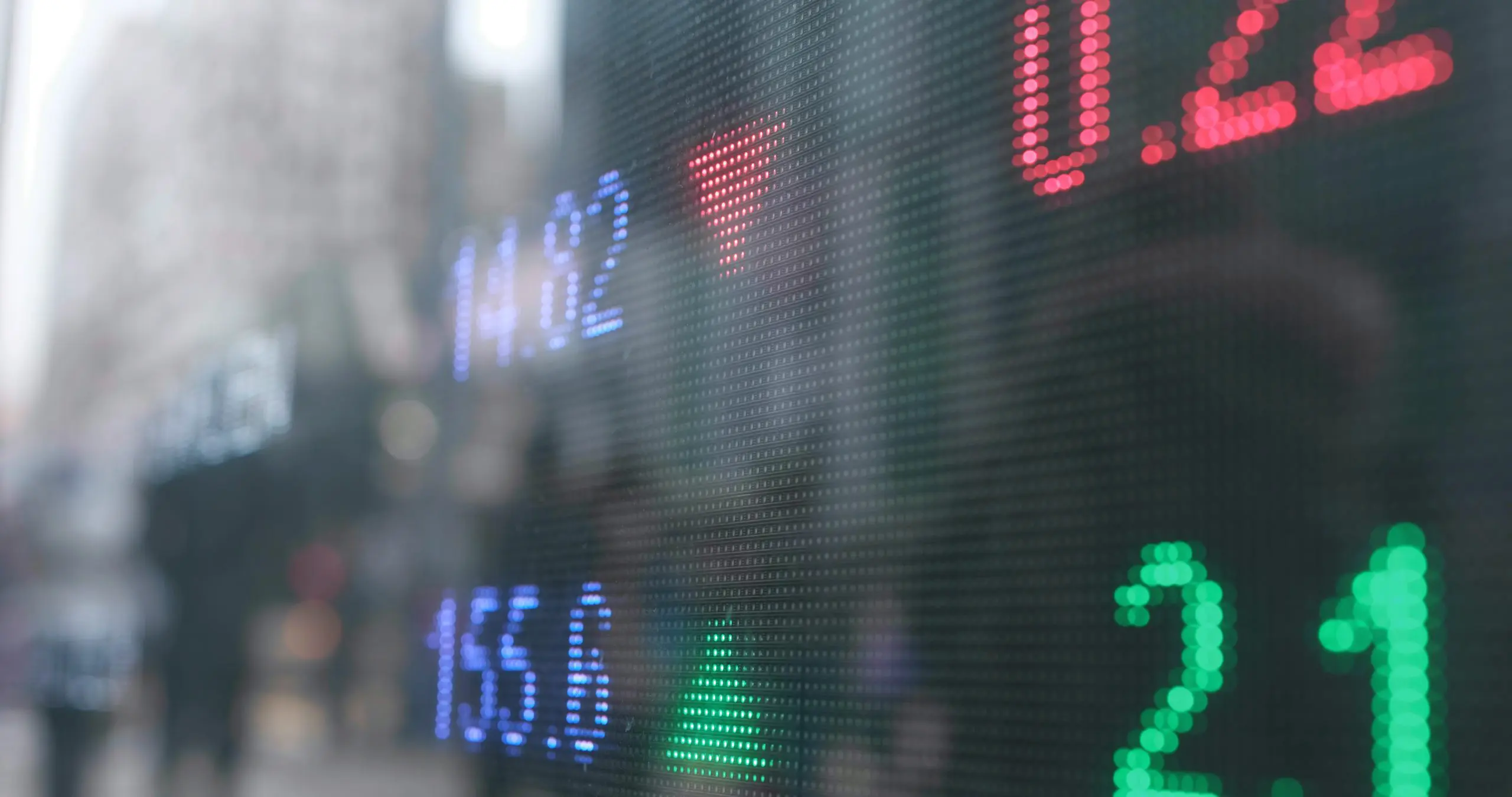 Electronic display showing index prices, financial data, and market fluctuations.